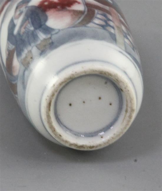 A Chinese underglaze blue and copper red snuff bottle, 19th century, 8.6cm excl. stopper